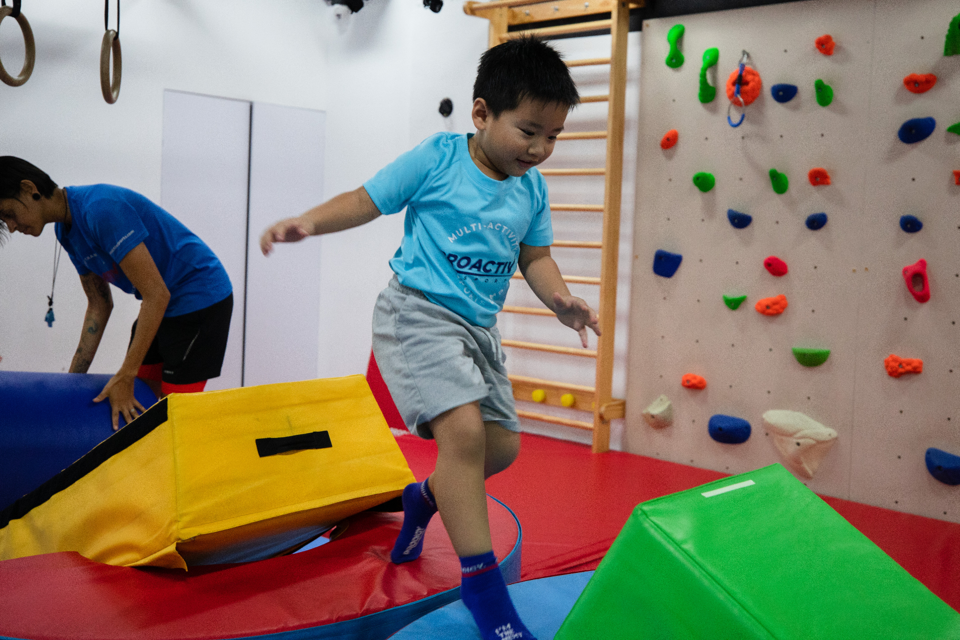 Camper running through a soft-play obstacle course at Prodigy