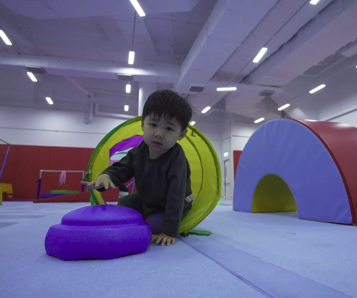 Toddler exploring the Mini-Camp soft play setup at ProActiv Hong Kong