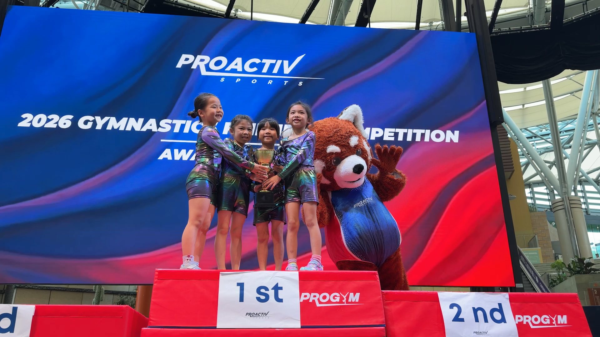 Young gymnasts on the podium at the ProActiv Sports 2026 Gymnastics Friendly Competition