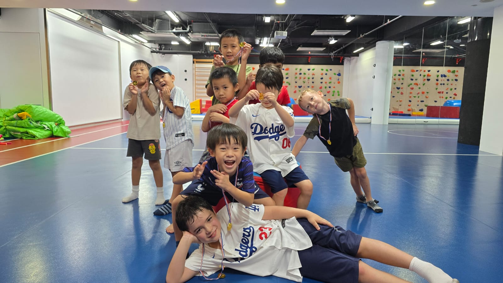 Kids with medals after birthday party games at Prodigy at Katong Point