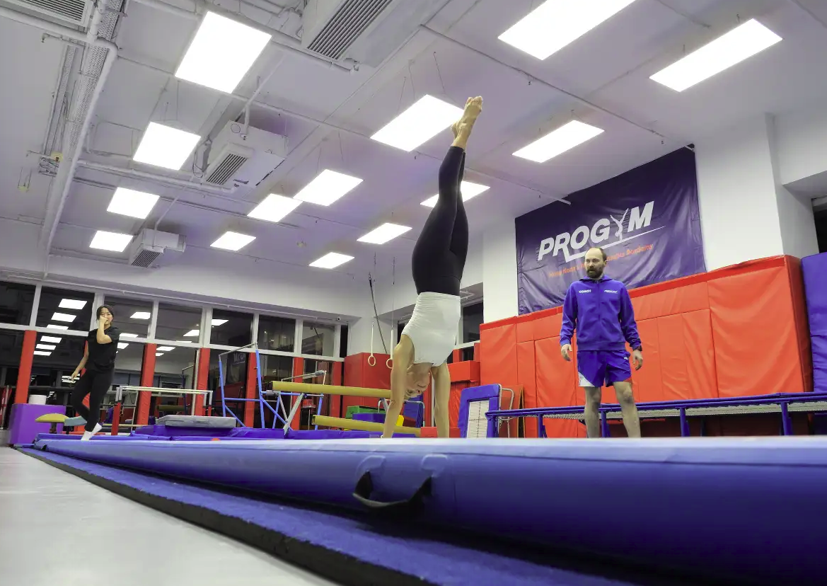 Adult handstand on beam at ProGym Wan Chai