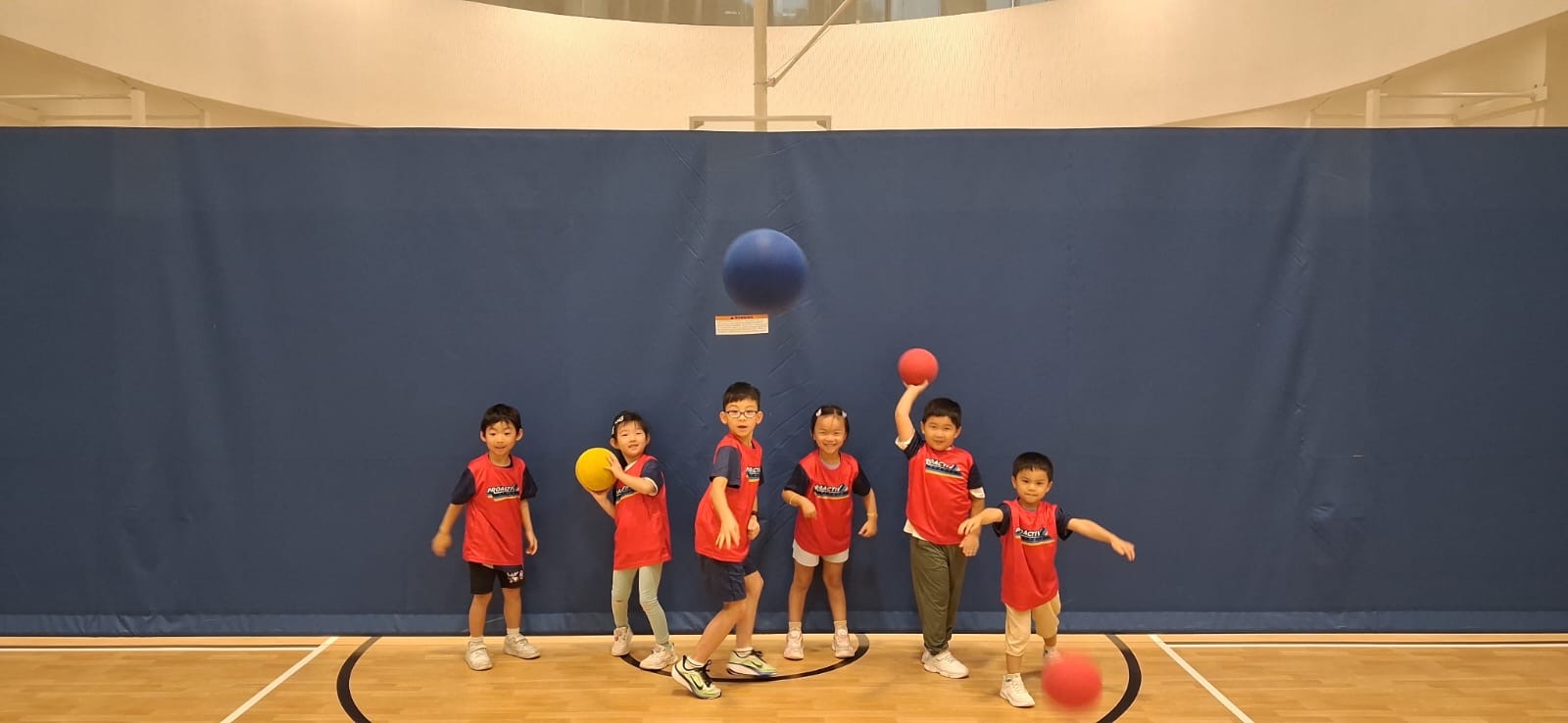 Children playing dodgeball at a ProActiv Hong Kong Multi-Activity Camp