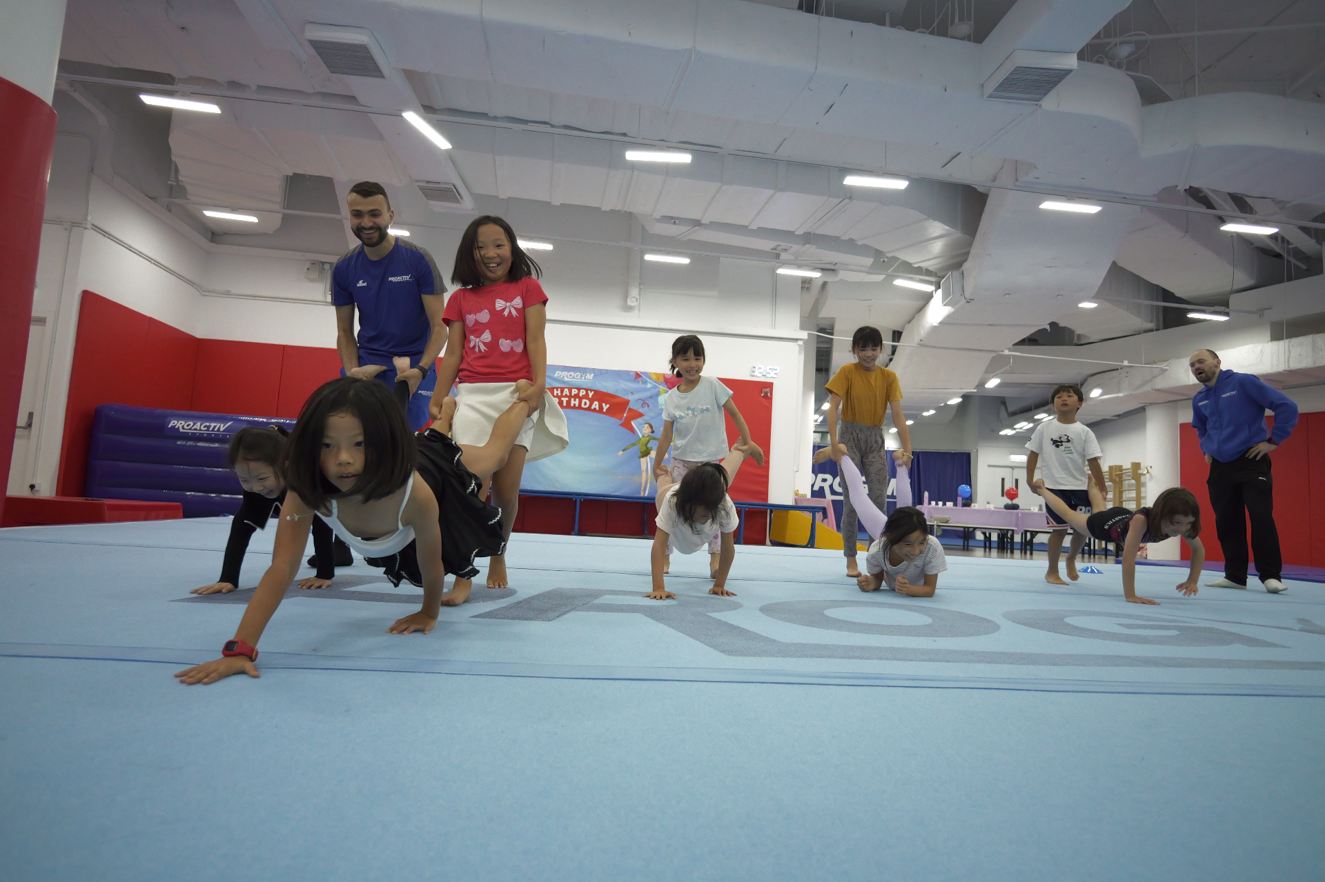 Coaches leading a fun races game during a birthday party at ProGym Hong Kong