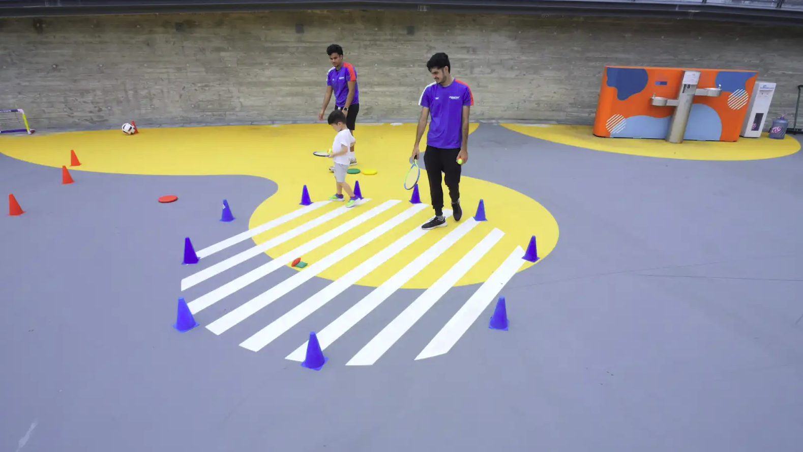 Coaches running a multi-sport circuit at a ProActiv Hong Kong camp