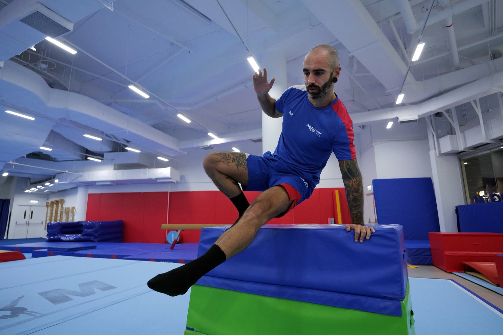 Young athlete performing a safety vault during a parkour class at ProGym Cyberport