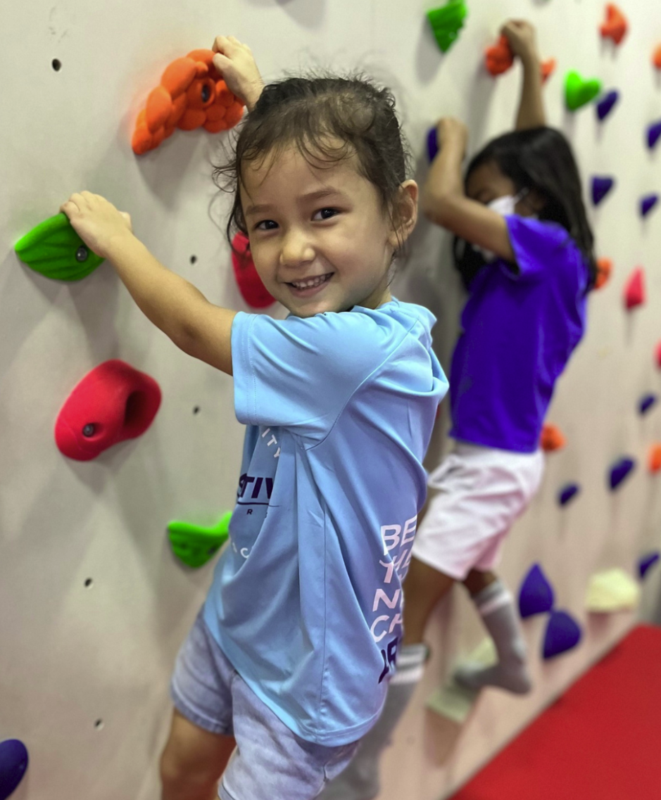Young child climbing at a ProActiv Sports session