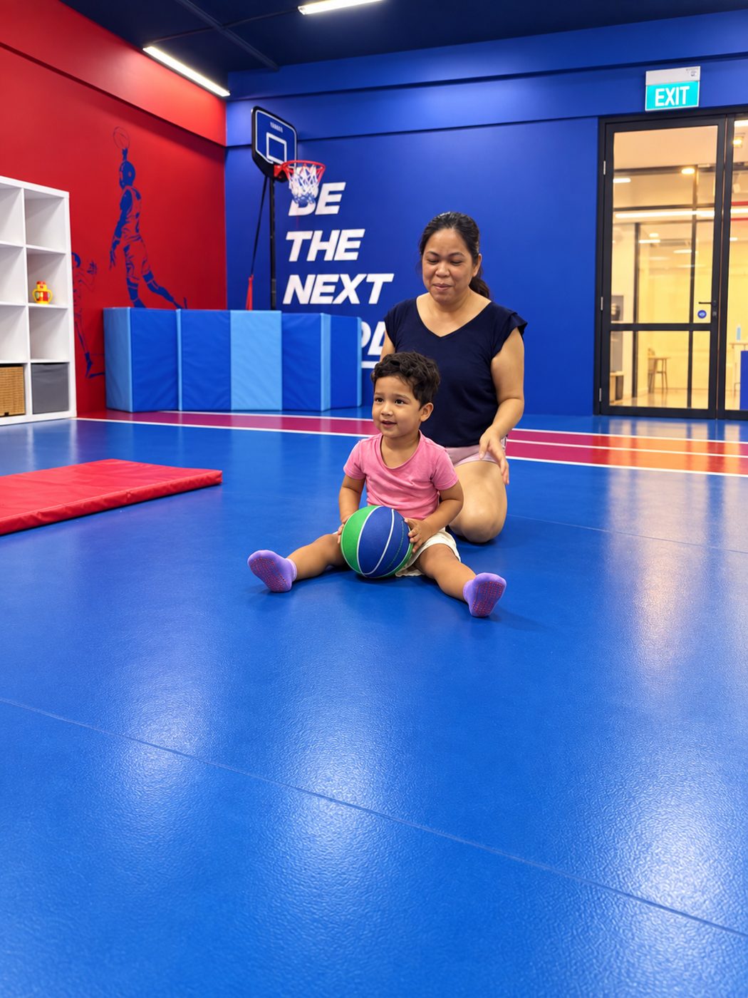 Toddlers playing with sports equipment at Prodigy at Katong Point